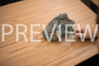 Preview of Stock Photo: Rock & Magnifying Glass-Personal & Commercial Use